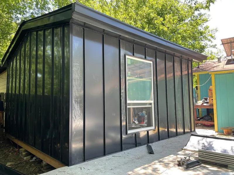 Black standing seam metal wall panels for Roof Inspection in St. Augustine