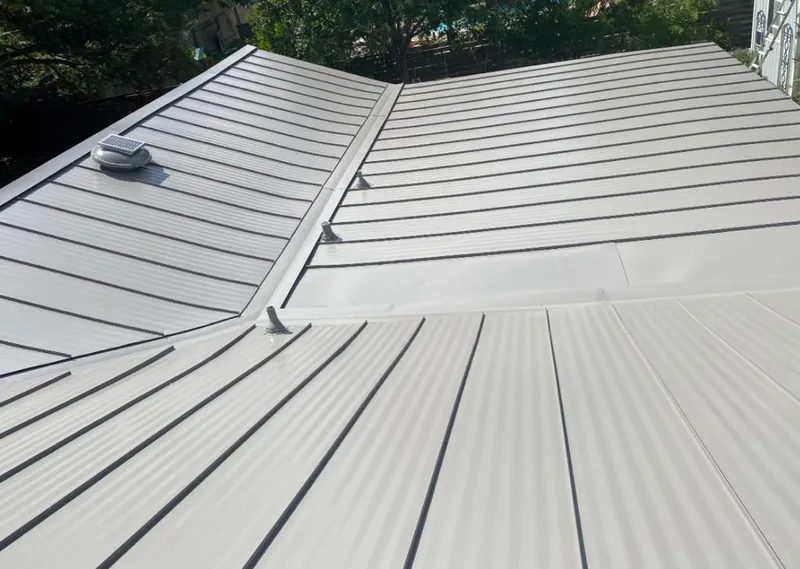 Solar attic fan installed on a metal roof for Roof Ventilation in St. Augustine